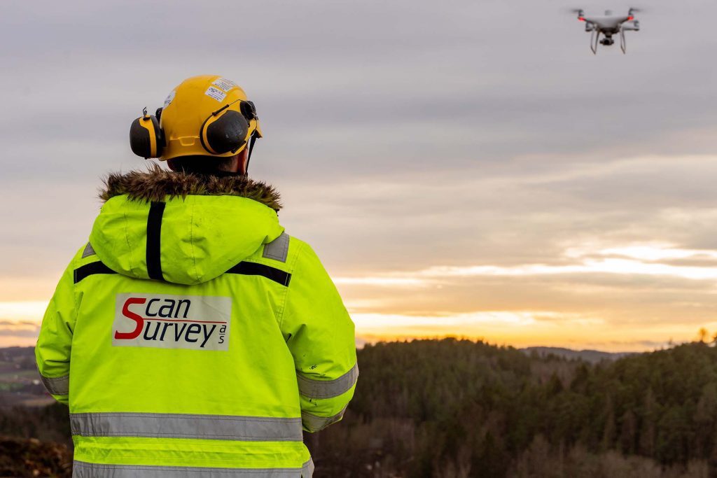 Scan Survey employee flying drone